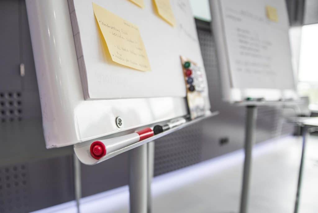 board, pens, sticky notes, workshop, business, office, paper, meeting, event, workplace, work, whiteboard